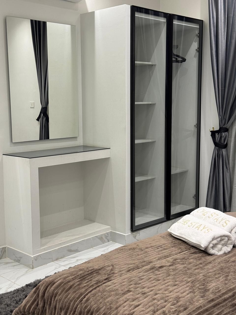 Master bedroom — glass-door wardrobe